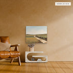 Beyond the Hedgerow canvas, 20 x 16 in, above an armchair; room setting for illustration