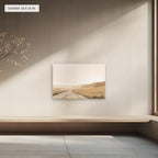 Rolling Fields Under a Pale Sky canvas, 36 x 24 in, above a bench; room setting for illustration